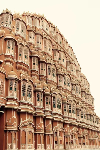 The distinctive facade of Hawa Mahal in Jaipur, a stunning example of Rajput architecture, on the Abu Road to Jaipur taxi tour.