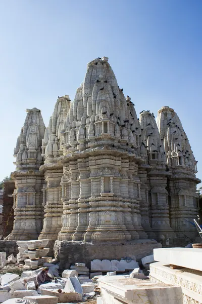 Intricate carvings on the ancient white marble Jain temples at Jirawala Tirth, a serene destination on the Abu Road taxi route.