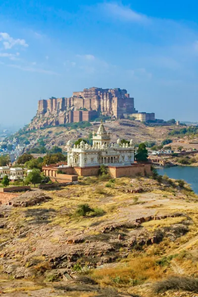 Mehrangarh Fort overlooking the blue city of Jodhpur, a prominent stop on the taxi tour from Abu Road, showcasing Rajasthan's grandeur.